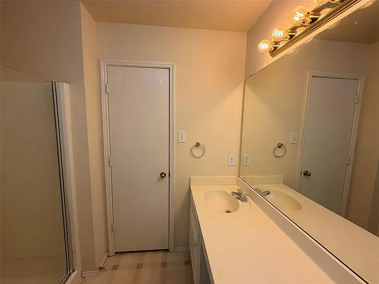 MASTER BATH FEATURING SEPERATE SHOWER VANITY WITH MAKEUP AREA.