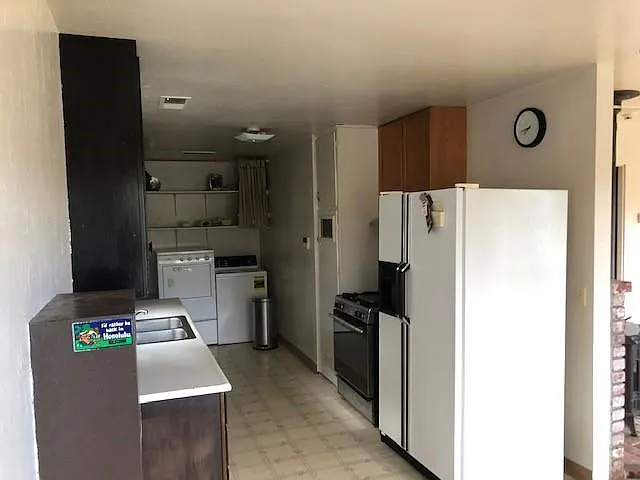 Kitchen and laundry room area.