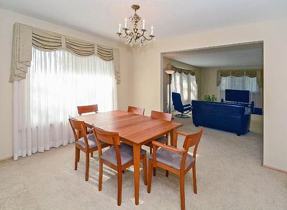 Formal dining room adjoined to the living room creates a larger, open space...yet still offering distinct spaces.