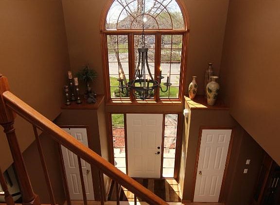 Large two-story entry way welcomes your guests into this beautiful home.
