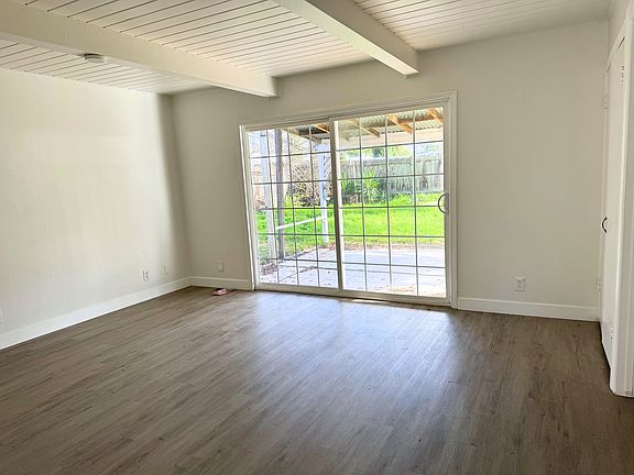 Second family room with double sliding doors to a large backyard.
