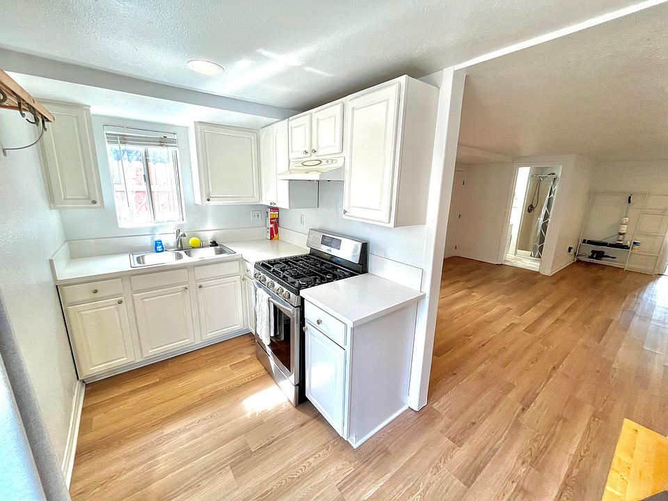 Kitchen - Left of the photo is access to small backyard space