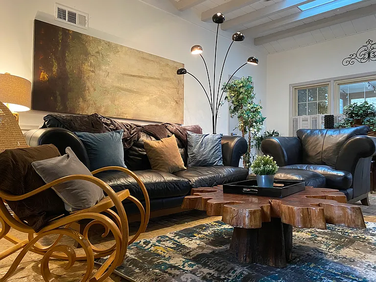Relax in comfort on the plush leather couch _ the perfect spot to unwind after a long day