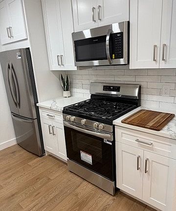 Beautifully updated kitchen with quartz countertops