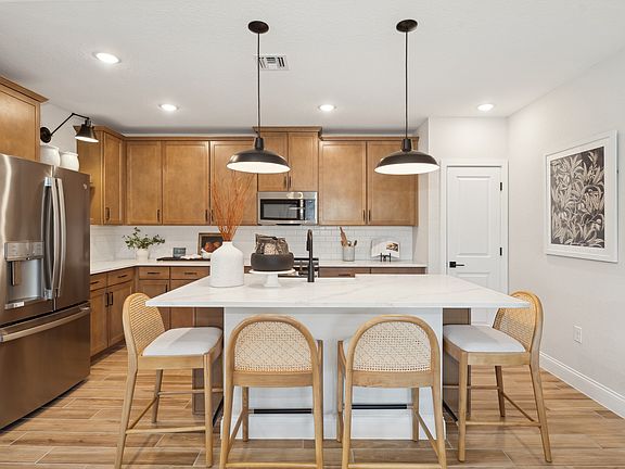 Kitchen with pendant lighting over center island