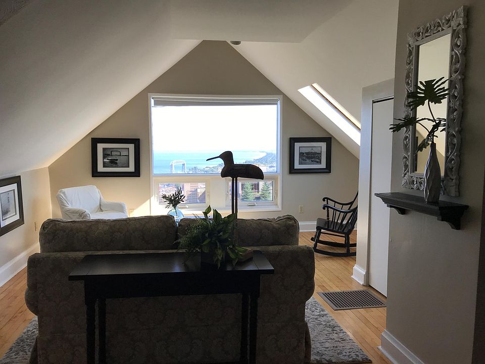 Great views from second floor living room with attached bedroom. Lots of natural light and wood floors... cozy, private, and pretty fabulous.