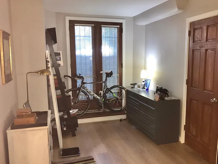 One side of the bedroom and door to walk-in closet