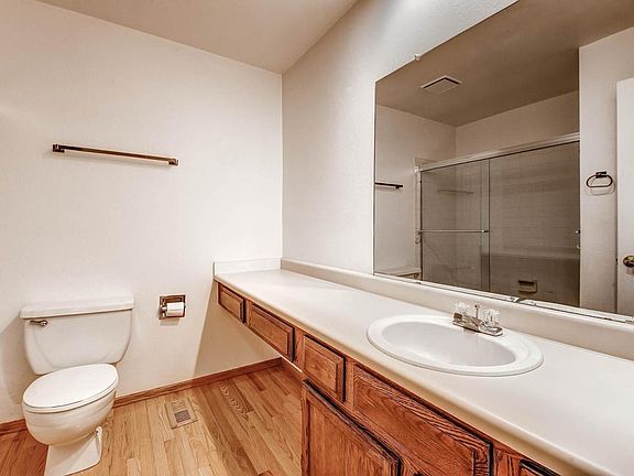 Main floor full bath with glass shower door.