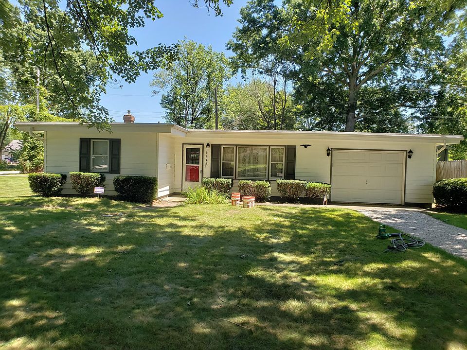 Front of house with attached one car garage