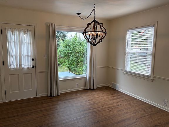 Dining area with door to patio and backyard