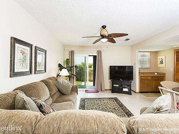 First floor living are with a sleeper sofa and a luxe wet ba