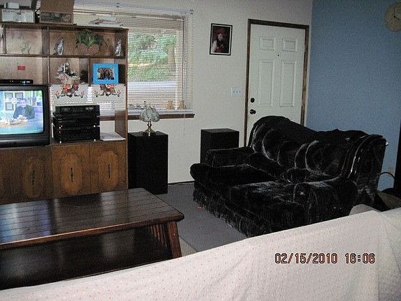 Living room has wood stove