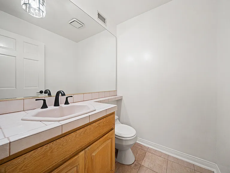 Main Floor Powder Room next to Front Entryway