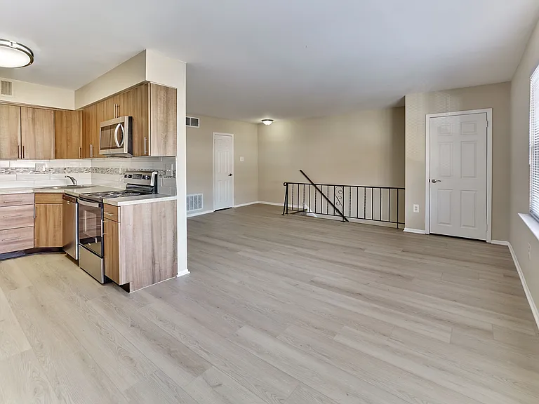 Sleek kitchen design meets spacious living at Maple Grand Apartments in Maple Shade, NJ.