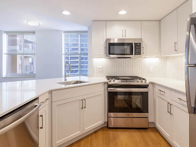 Kitchen with Gas Stove, Stainless Steel Appliances and Quartz Countertops