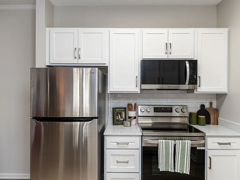 Kitchen with modern cabinetry & stainless appliances