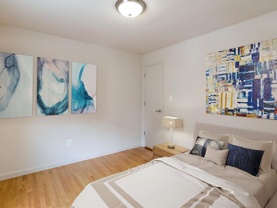 Bedroom (virtually staged). Window on West side.