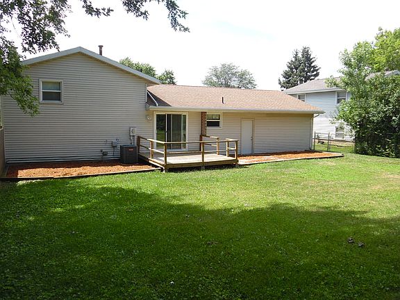 Back of house with deck