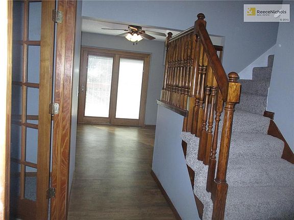 The front entry boasts a vaulted ceiling and skylight. Walk through to the sliding door ahead that leads to the decks. Just to the left of the entry is the living room with French doors. Stairs lead up to the bedrooms and laundry closet.