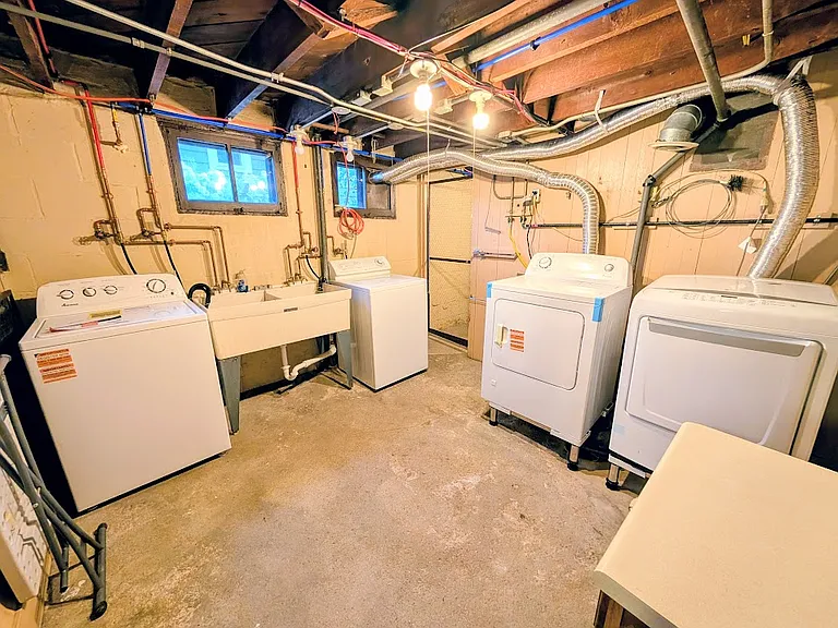 Laundry room in basement. Separate washers and dryers provided for both units