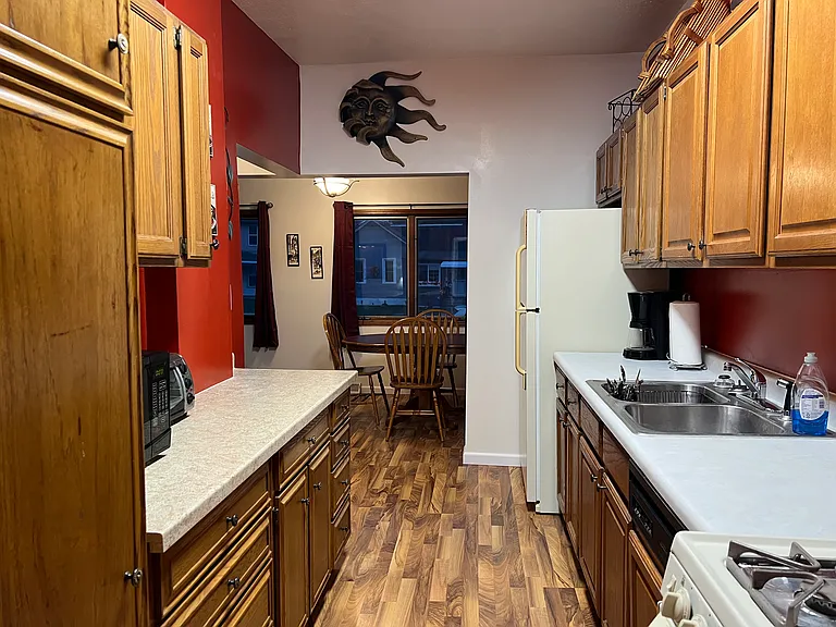View from walk-through kitchen toward dining area