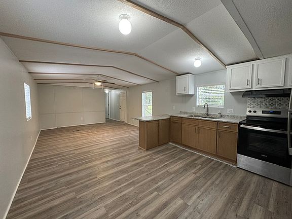 Back door view. New appliances. New countertops. New 34" cabinets.