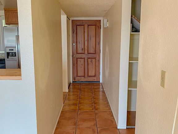 Front door entrance. - To the left on photo is the kitchen area - To the right of the photo is the hallway that leads to the 3 bedrooms and 2 baths. - Behind the photo is the living room area.