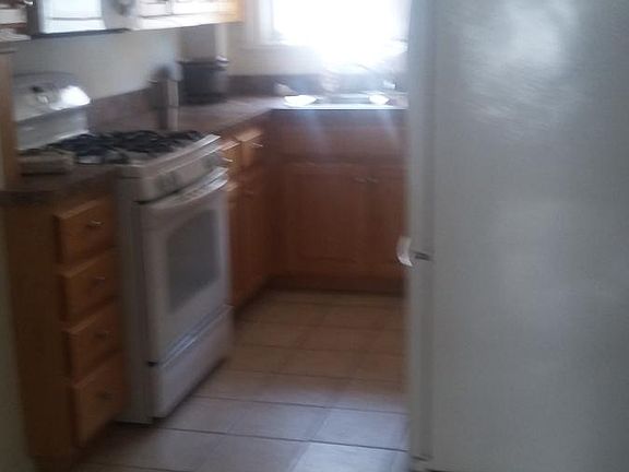 More kitchen with refrigerator