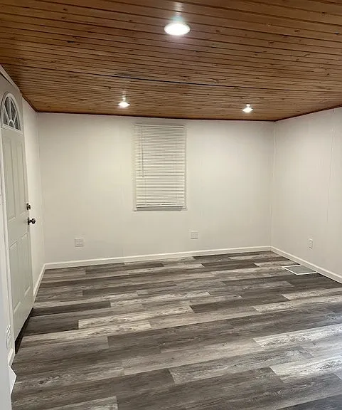 Larger view of Living Room. New Floor. Front Door to house on left. That is the door off the front porch of the house. Recessed dimming lights in ceiling.