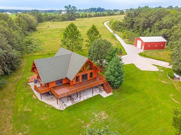This beautiful home sits on 20 acres of secluded land with a private 21 acre watershed lake