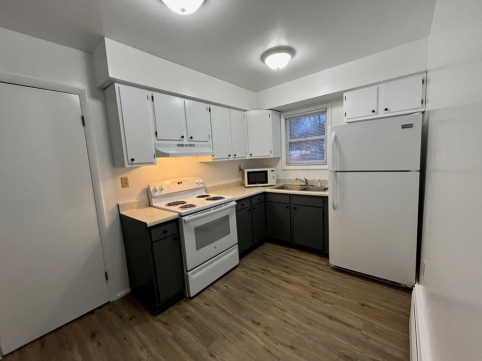 freshly painted kitchen cabinets. Storage closet to left.