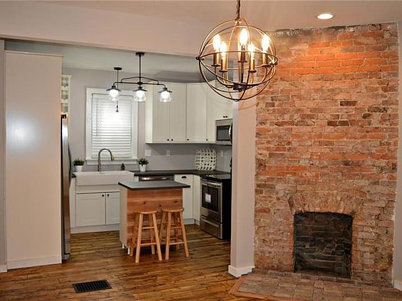 Exposed brick, new kitchen, removed wall.