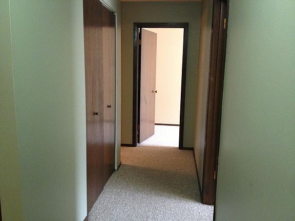 Hallway to bedrooms and bathroom. Large linen closet on left. Bathroom further down on left. Master bedroom straight ahead. Second bedroom on right.