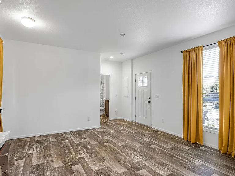 Living room/kitchen (like a studio), but both bed rooms have their own attached bathrooms and separate rooms.