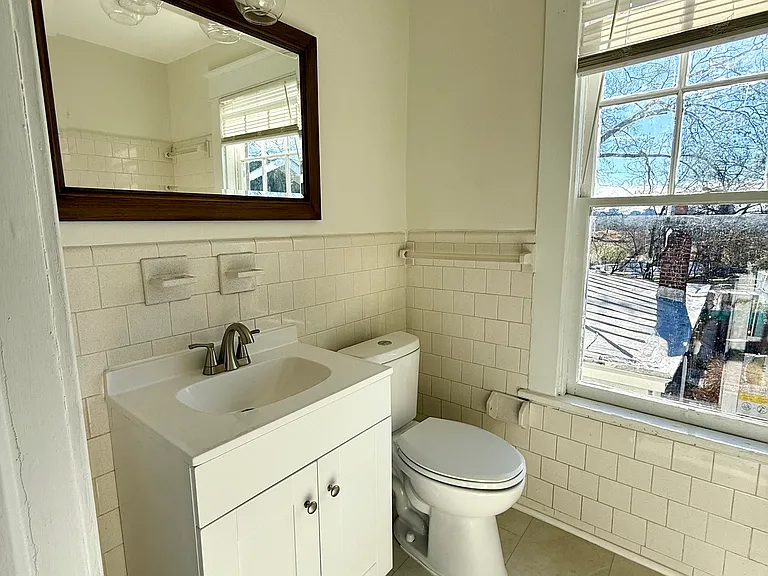 Upstairs bath with tube