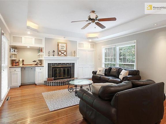 The Family Room is a great space for all your family gatherings.  Fresh trim and wall paint make this room very cheery.  Gas starter fireplace will be great this Fall/Winter and entertaining is easy with the dry bar area with granite counter and shelving.