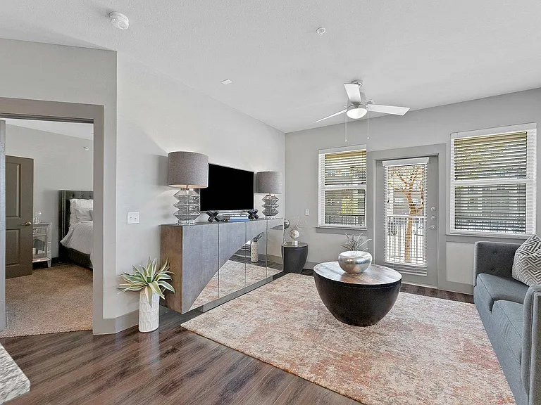 Open-concept living room with seamless flow into the bedroom