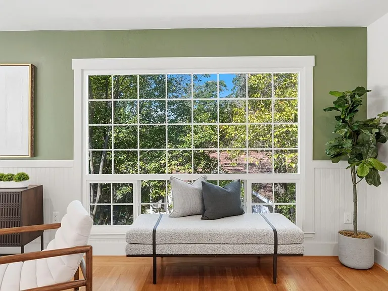 Oversized picture windows bringing the outdoors inside