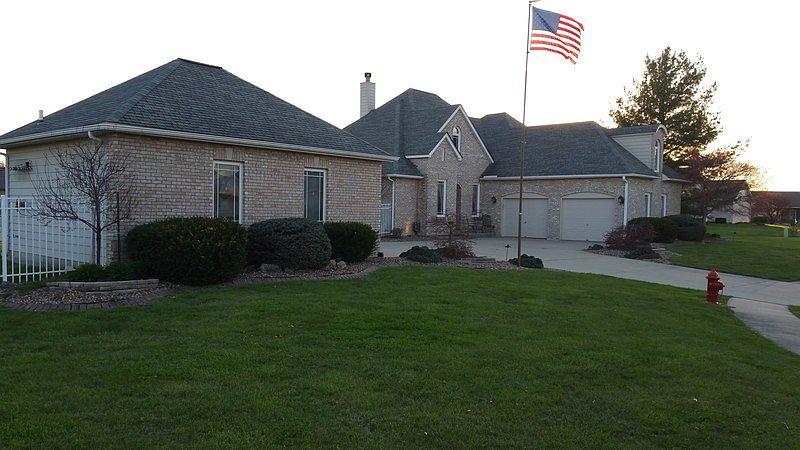 Front View of Home and Detached Garage