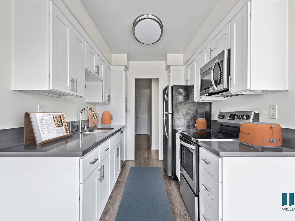 Kitchen with Stainless-Steel Refrigerator, Stove, Microwave Oven, and Dishwasher