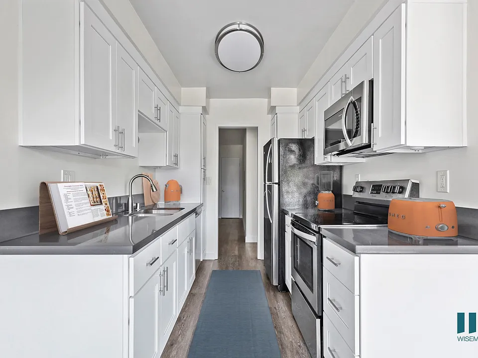 Kitchen with Stainless-Steel Refrigerator, Stove, Microwave Oven, and Dishwasher
