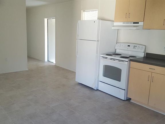 View of Front Door/Kitchen/Living Area
