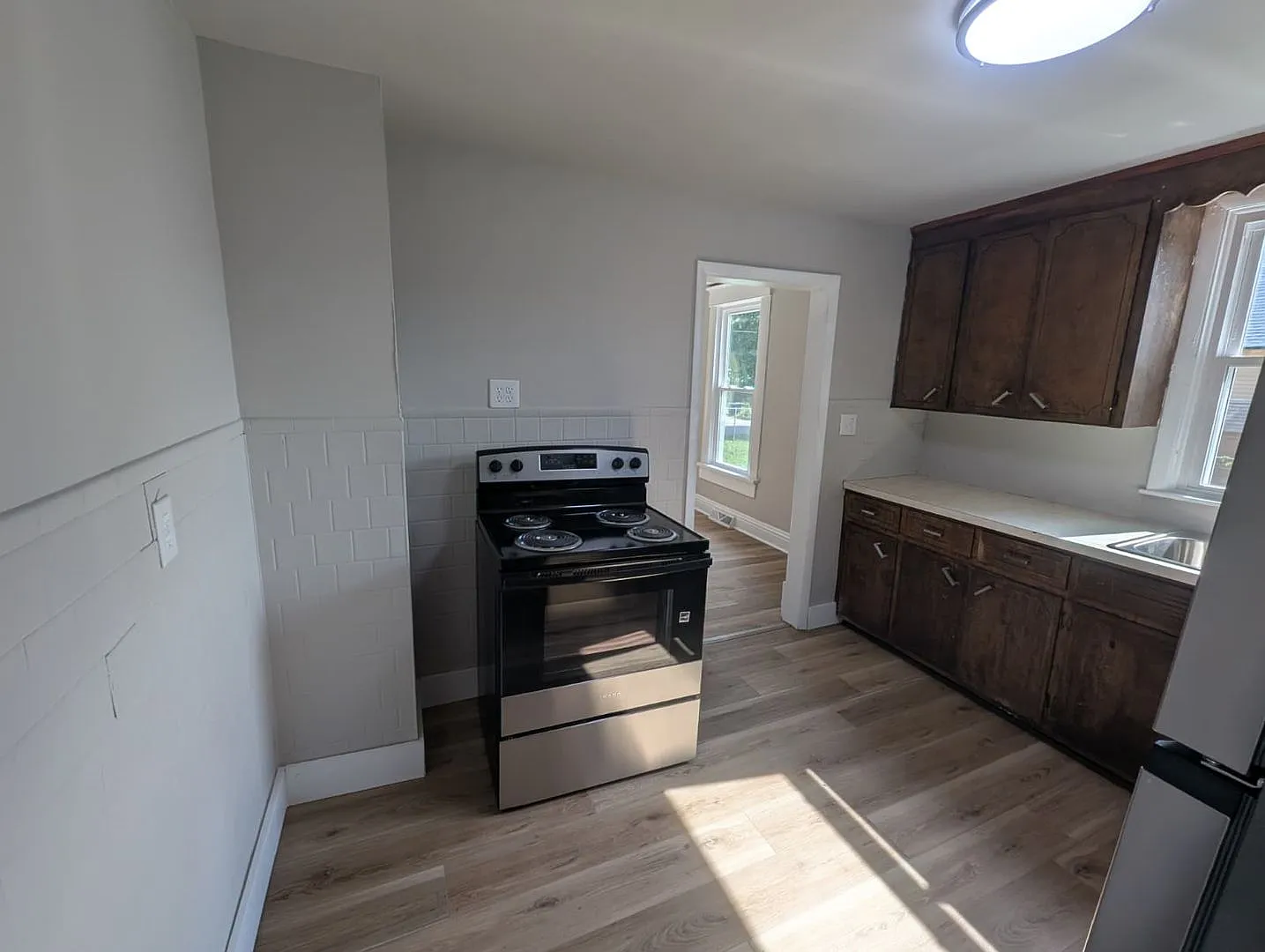 2-Bedroom Home with Fenced Yard, Off-Street Parking & Full Basement — Photo 4