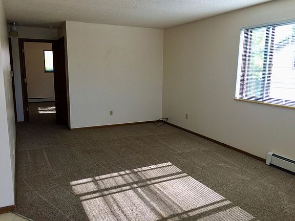 Large living room with lots of natural light.