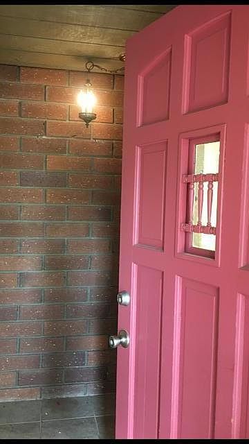Windowed Front Door opens to Bricked entry wall