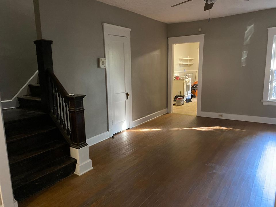 Spacious dining room with hardwood floors.