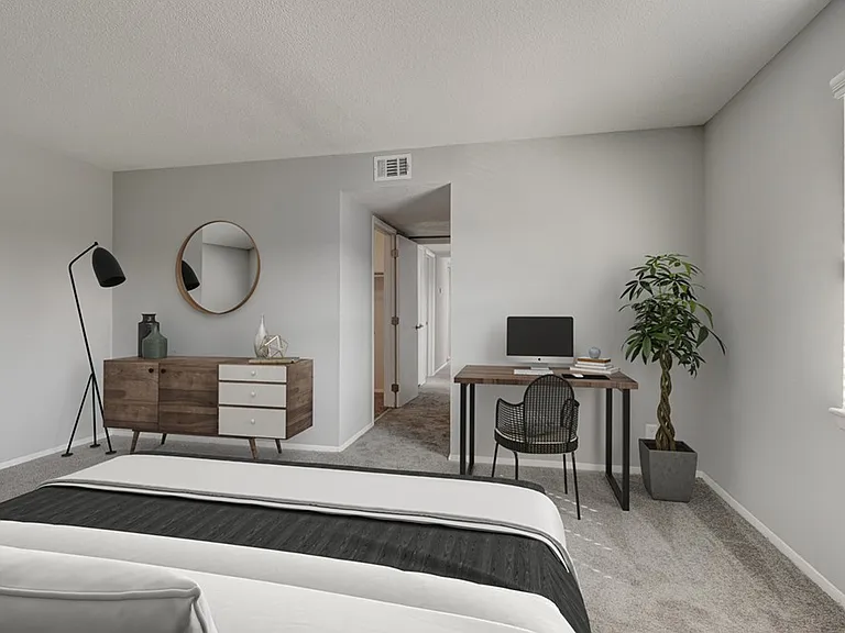 Step into modern living at Crossings @ 501 Apartments. This stylish bedroom features sleek furnishings and a dedicated workspace, perfect for productivity and relaxation. Don't miss out on your ideal homeschedule a tour today!