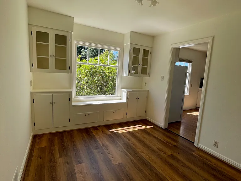Cozy dining area with built-in cabinetry.