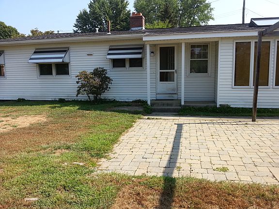 patio in fenced backyard