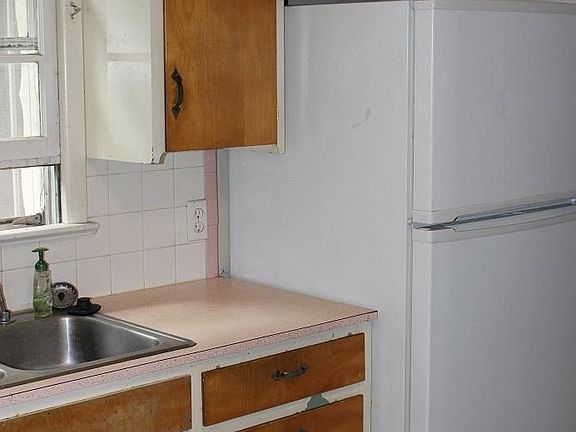 Part of kitchen newr fridge with Ice Maker